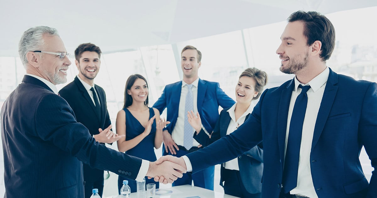 Group of employees celebrating a promotion